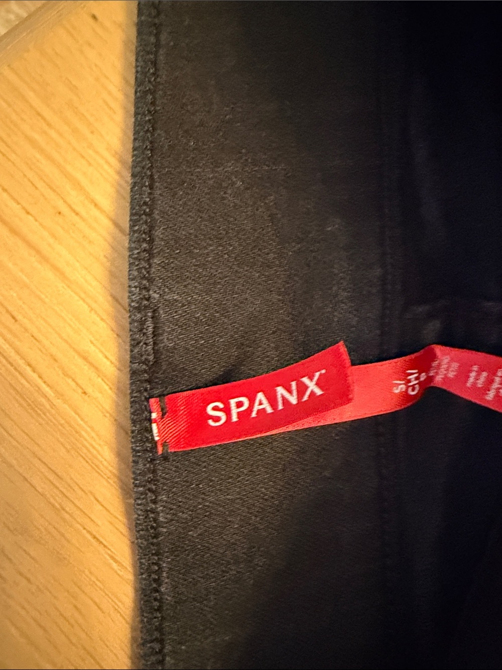 SPANX High-Rise Pull-On Flare Jeans in Black - Picture 6 of 8